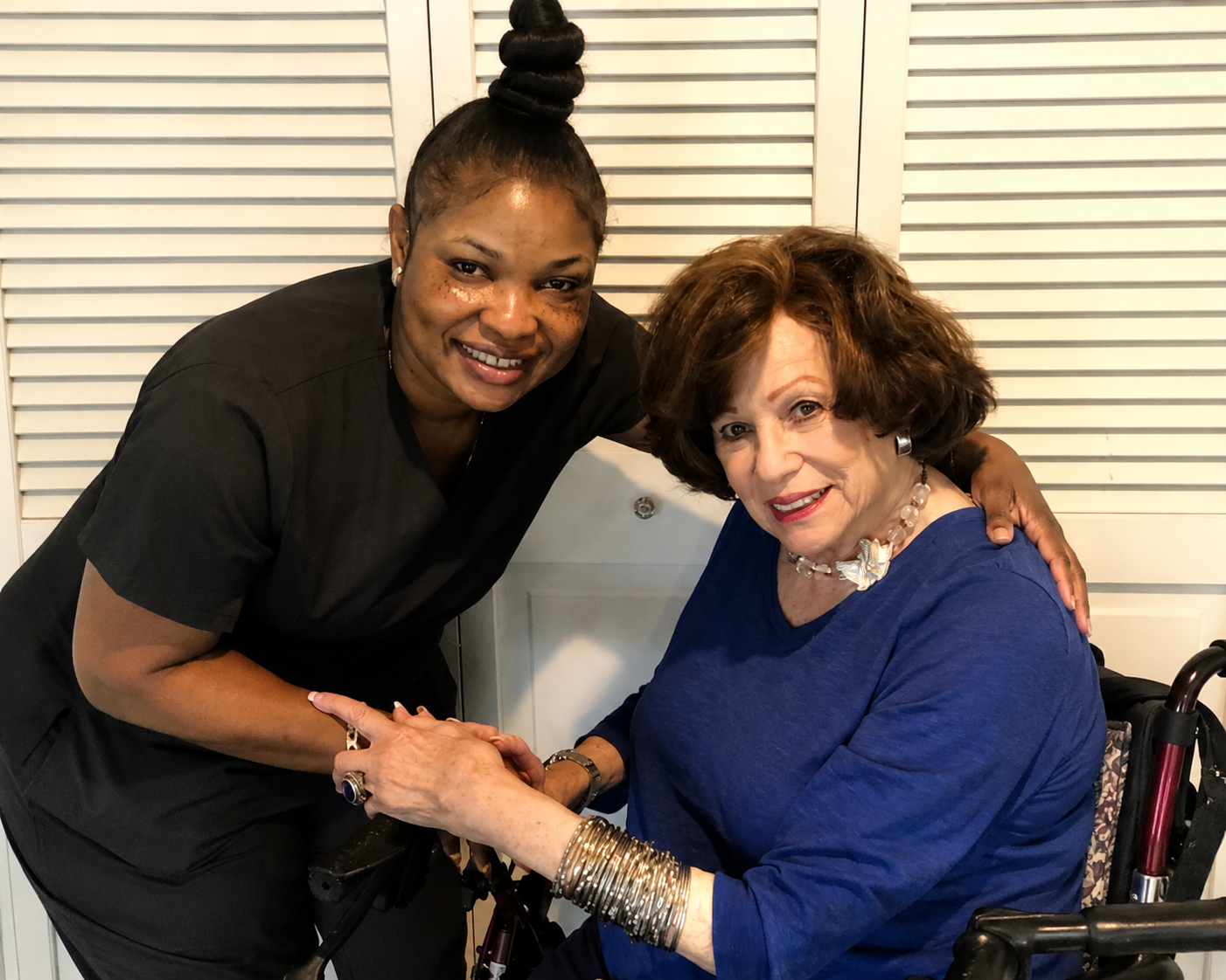 Hanameel caregiver sharing a warm moment with a client at home