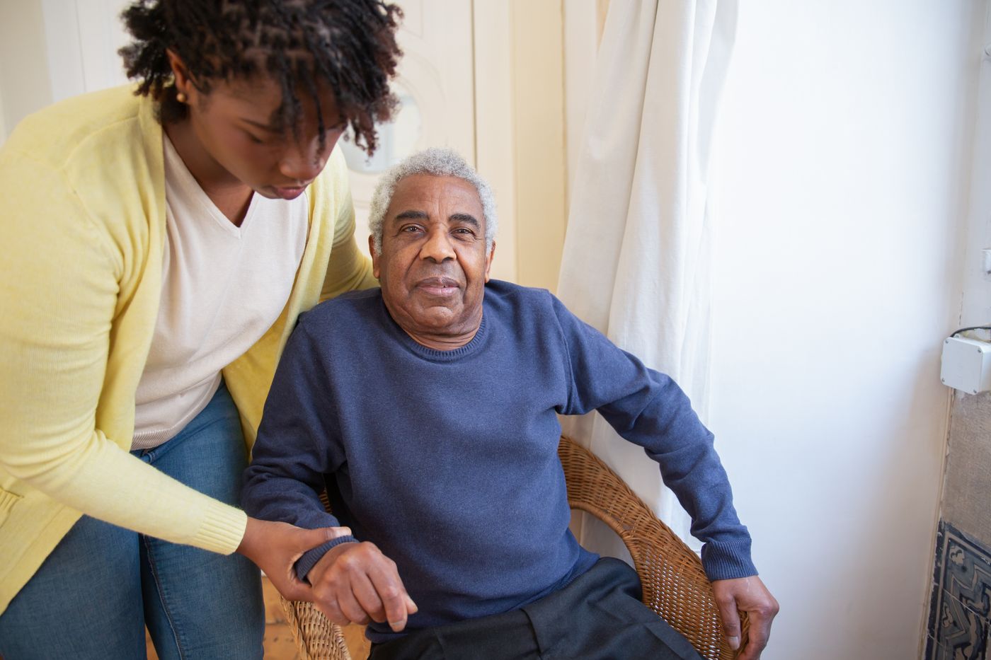 Caregiver staying with an older adult at home for around-the-clock support